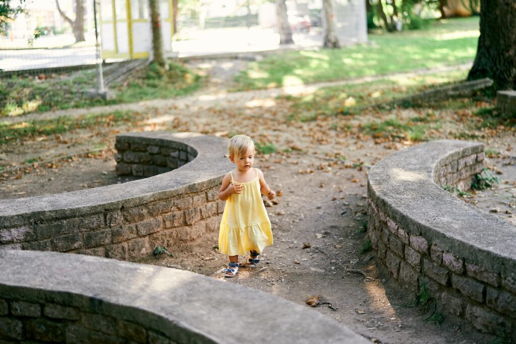 A girl enjoys a yard after we've provided help for maintaining your outdoor living space in Overland Park